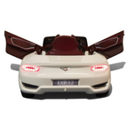 Voiture électrique enfant Petit Pilote Bentley EXP blanche avec portes papillon ouvertes et feux arrière LED allumés