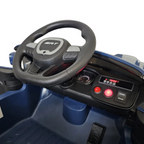 Poste de conduite de la voiture électrique Petit Pilote Dodge SRT bleue avec volant sport et tableau de bord interactif