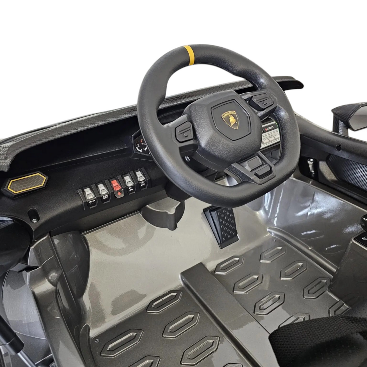 Intérieur de la voiture électrique enfant Petit Pilote Lamborghini Auténtica avec volant sport, siège cuir et pédale