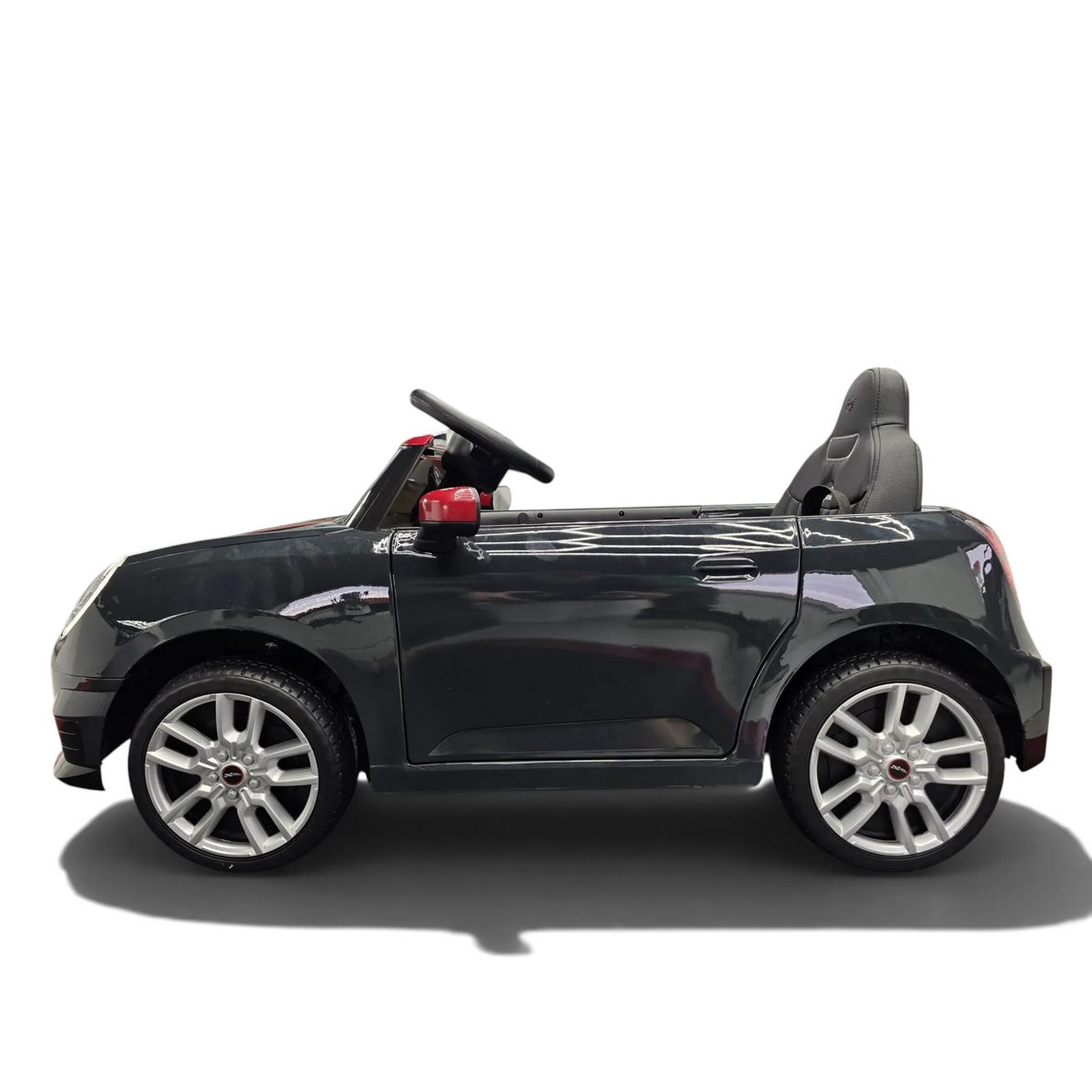 Voiture électrique enfant Petit Pilote Mini Cooper S noire métallisée avec siège en cuir et pneus EVA