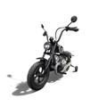 Moto électrique enfant Petit Pilote BMW R18 24V noire avec pneus à air et siège en cuir dans un showroom