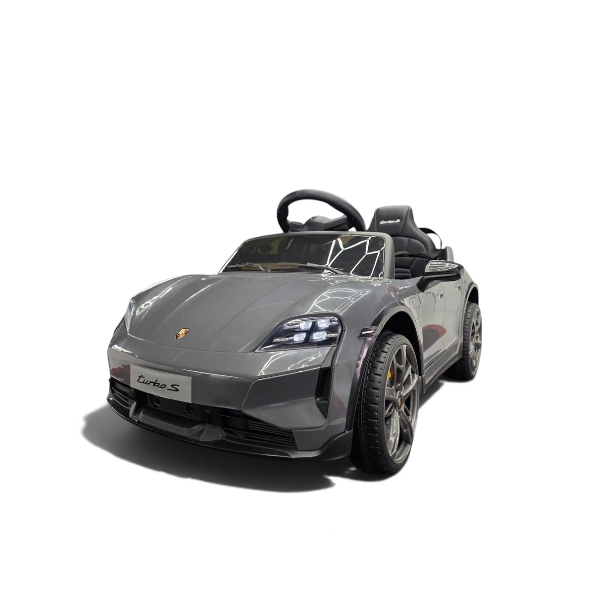 Voiture électrique pour enfant Petit Pilote Porsche Taycan grise avec phares LED, siège en cuir et détails réalistes