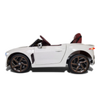 Voiture électrique enfant Petit Pilote Bentley Bacalar blanche avec siège en cuir et pneus caoutchouc, vue de profil