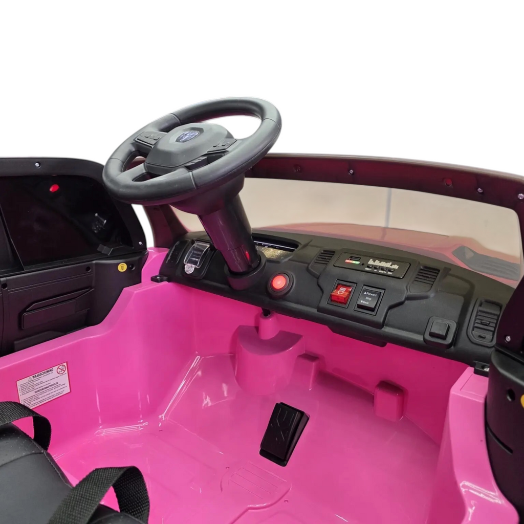 Intérieur rose de la voiture électrique enfant Dodge RAM 12V Petit Pilote avec volant, tableau de bord et siège en cuir
