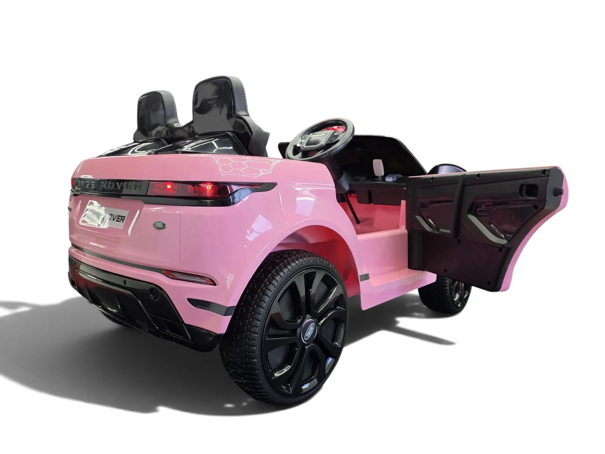 Voiture électrique enfant Petit Pilote Range Rover Evoque rose avec porte ouverte, pneus caoutchouc et détails réalistes