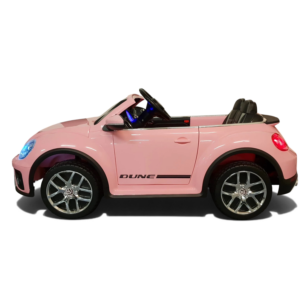 Voiture électrique enfant Petit Pilote VW Beetle rose avec siège en cuir, pneus caoutchouc et détails chromés