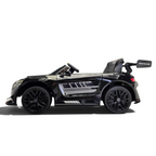 Voiture électrique enfant Petit Pilote Mercedes AMG GT3 noire métallisée avec siège en cuir et pneus EVA, vue de profil