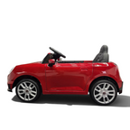 Voiture électrique enfant Petit Pilote Mini Cooper S rouge métallisé avec siège en cuir et pneus EVA, vue de profil
